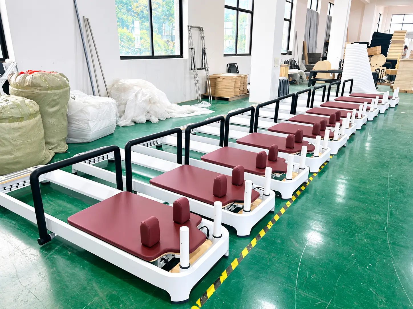 Reformer Row In A Sunlit Workshop